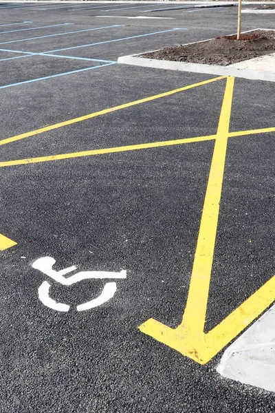 Wheel chair symbol in disabled parking permit sign painted
