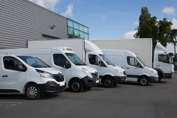 White Delivery Trucks Backed Warehouse Building — Stock Photo, Image