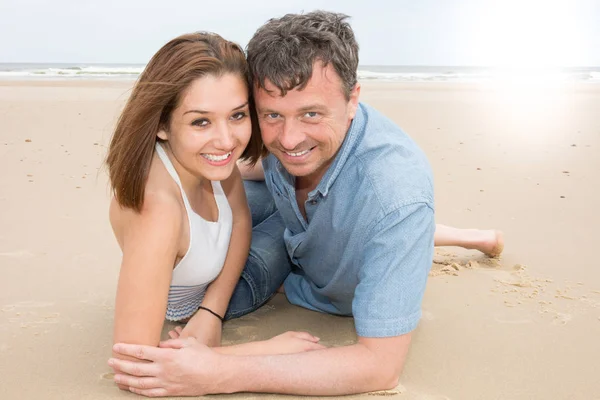 Young couple in love outdoor sea beach Stunning sensual outdoor portrait of stylish fashion couple posing in summer