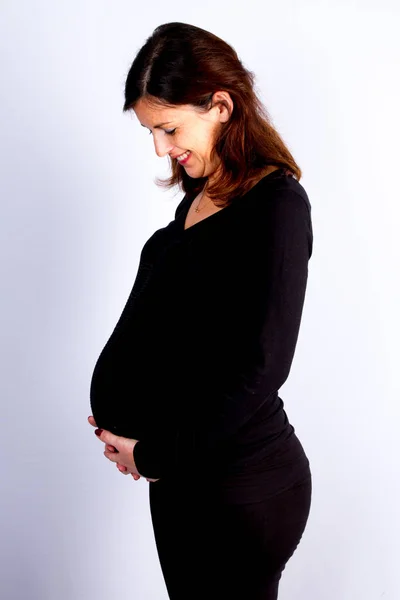 Retrato Mujer Embarazada Feliz Orgullosa Mirando Vientre Fondo Gris Blanco —  Fotos de Stock