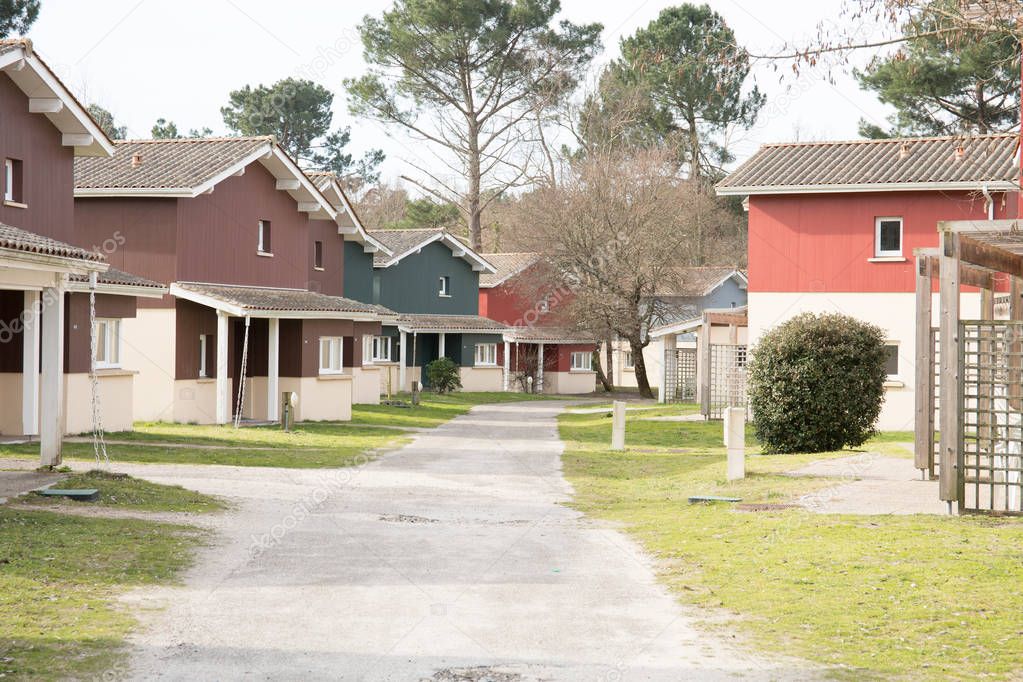 little road in village with wood house