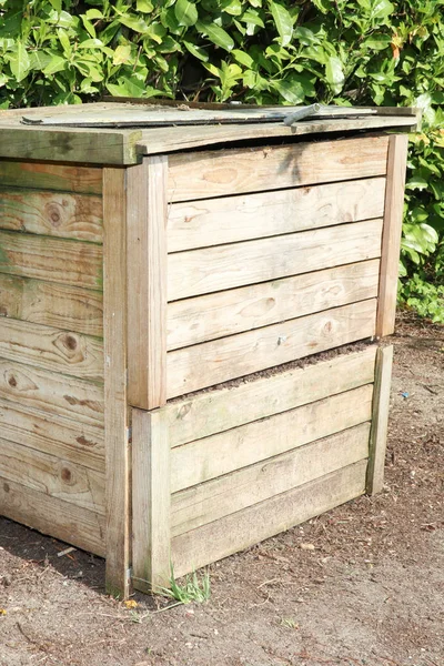 wood compost bin with organic material