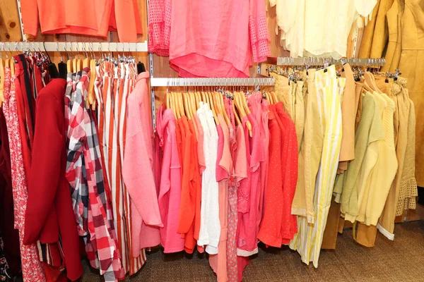 Various color shirts in shop Fashion and shopping concept