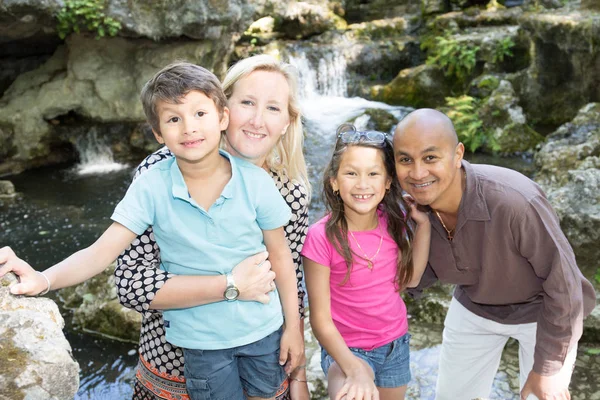 Beautiful diverse Portrait of a happy family visiting in the park