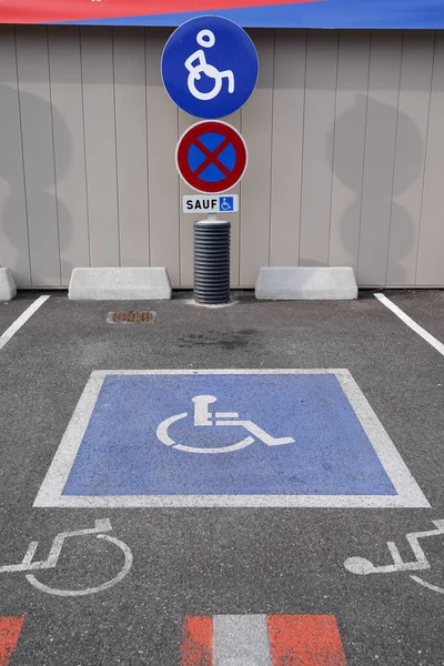 empty parking lot with Handicap sign symbol logo on road traffic and pedestrians
