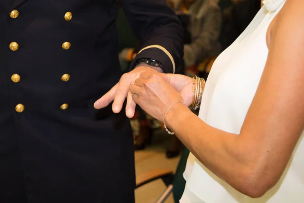 wedding bride exchanges alliances with army officer groom during marriage celebration day