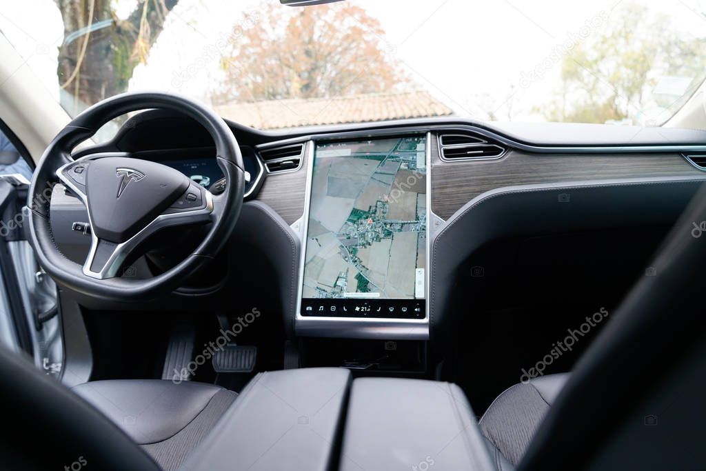Bordeaux , Aquitaine / France - 11 30 2019 : tesla interior digital dashboard on electric car model s steering wheel