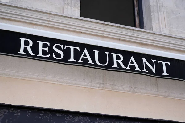 restaurant text sign building facade in street signboard