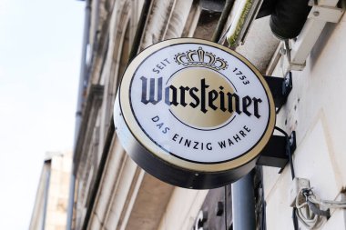 Bordeaux , Aquitaine / France - 01 15 2020 : warsteiner beer sign logo on restaurant bar wall building clipart