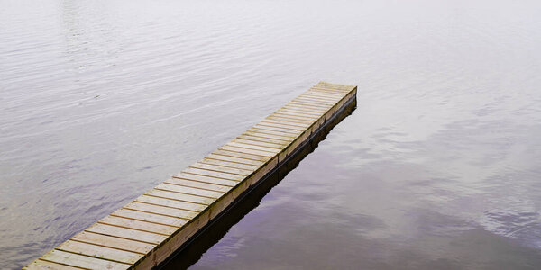 wooden detail background pontoon on water lake in web banner template header