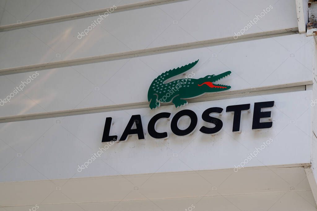 Bordeaux , Aquitaine / France - 02 15 2020 : Lacoste crocodile logo closeup of shop sign on store front