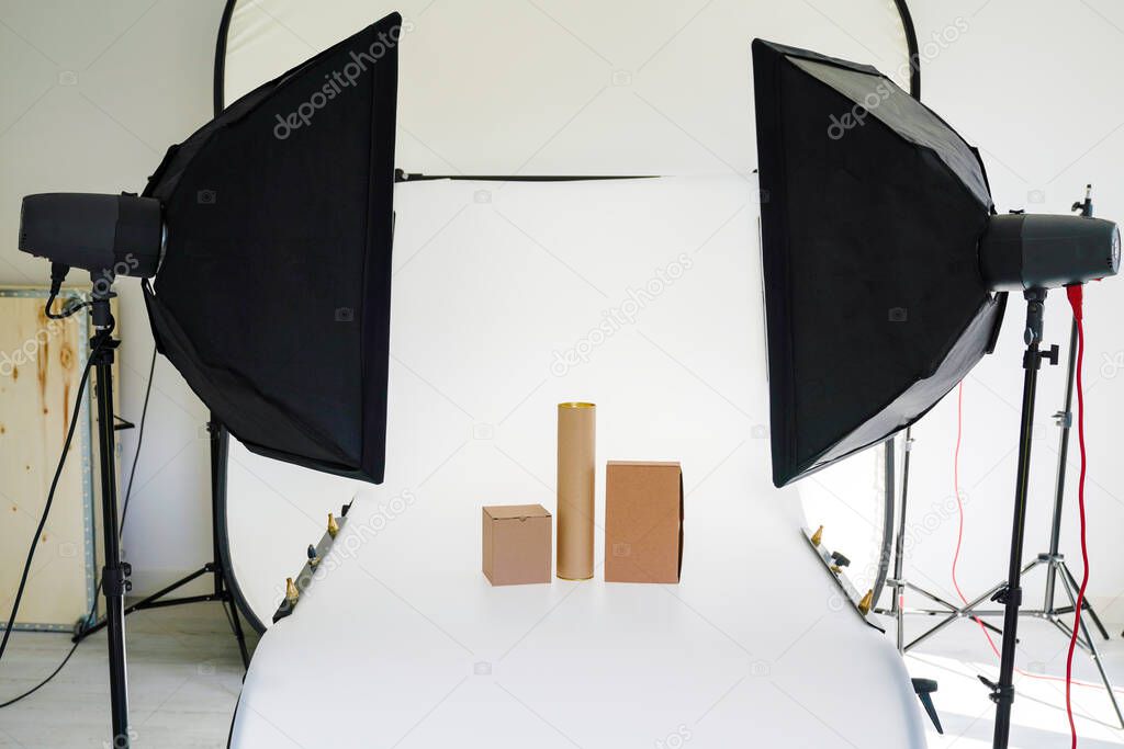 Professional photography equipment prepared for shoot brown boxes in studio