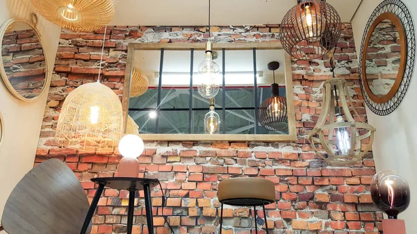 House Shop Brick Red Wall Retro Mirror Different Modern Chandeliers — Stock Photo, Image