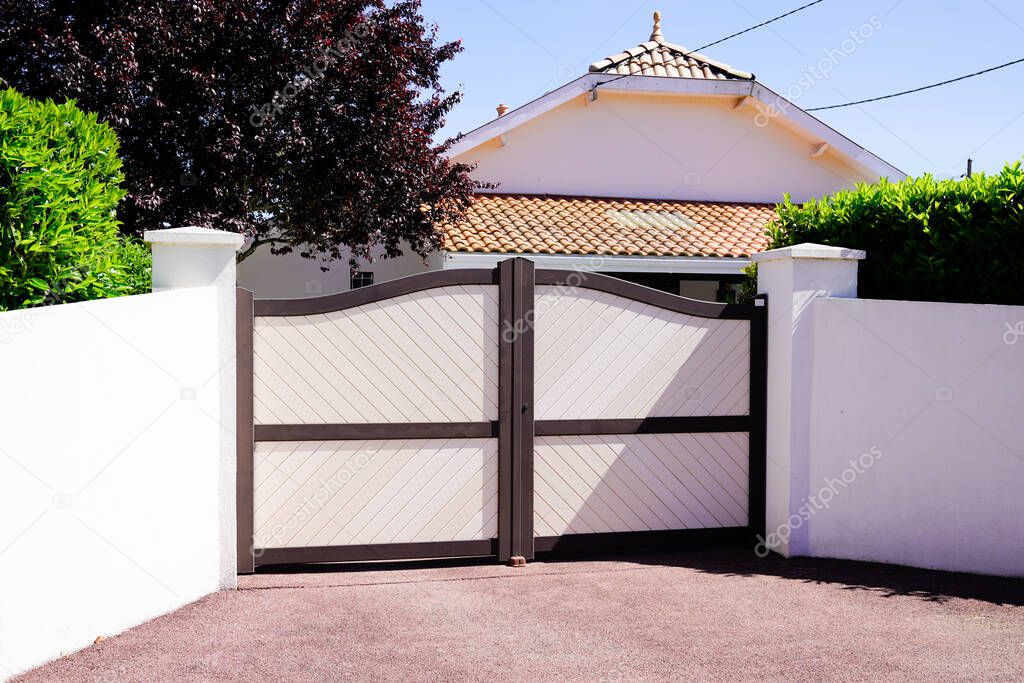 residential brown sandy portal home suburb metal aluminum house gate street wall