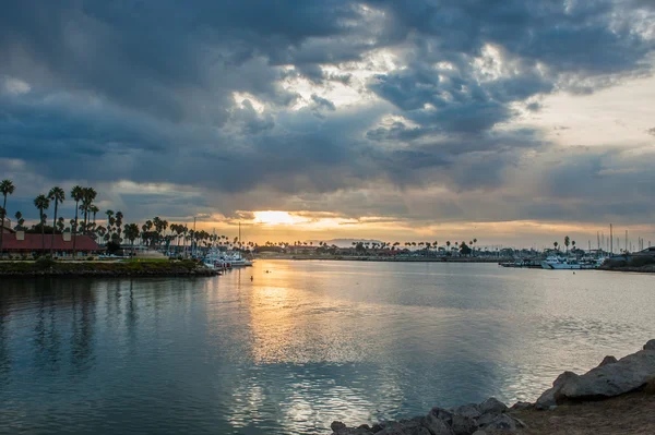 Break in the dawn clouds over marina — Stock Photo, Image
