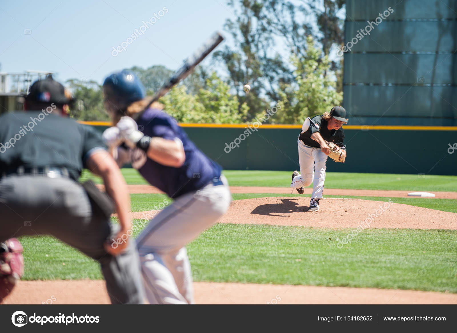Pitcher versus batter stock photo by motionshooter 154182652