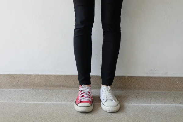 Funny Different Sneakers, Red and White Sneakers on Ground or Floor Background — Stock Photo, Image