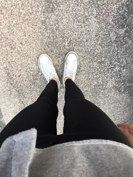 Young Fashion Woman's Legs with Sneakers, White Shoes on Floor Background — Stock Photo, Image