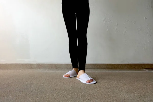 Closeup Photo of From Woman Wearing White Slippers and Black Pants — Stock Photo, Image