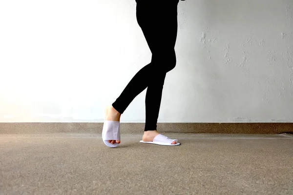 Closeup Photo of From Woman Wearing White Slippers and Black Pants — Stock Photo, Image