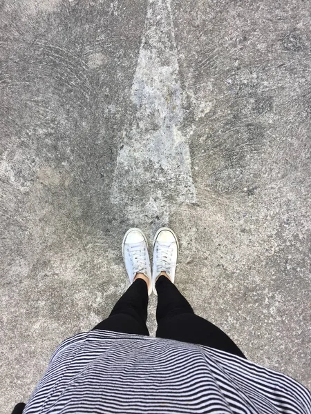 Closeup Photo of From Woman Wearing White Sneakers in The Street — Stock Photo, Image