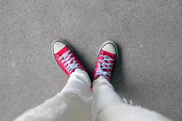 Selfie Feet Wearing Red Sneakers On The Concrete Floor Background — Stock Photo, Image