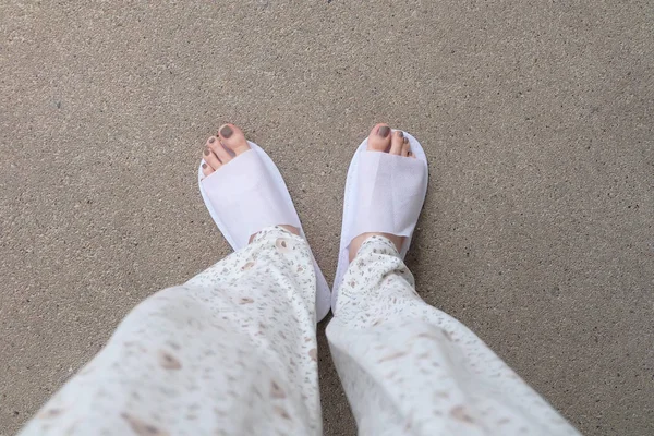 Selfie Feet Wearing White Slippers Indoor On the Ground — стоковое фото