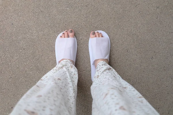 Selfie Feet Wearing White Slippers Indoor On the Ground — стоковое фото