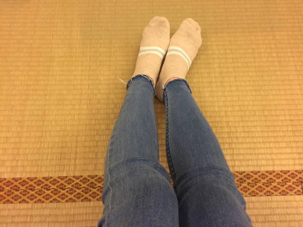 Selfie Feet Wearing Socks and Jeans on Wooden of Japanese Background — Stock Photo, Image