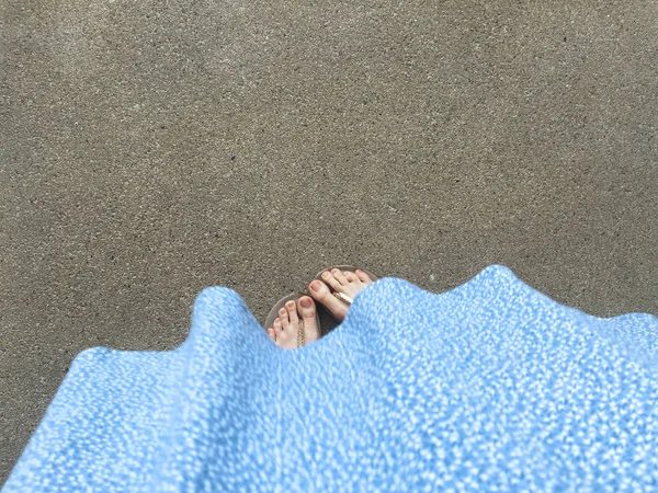 Female Feet Wear Sandals and Blue Dress on the Street