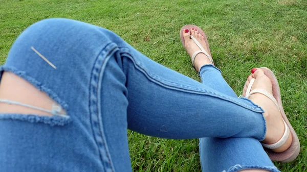 Feet Selfie in Gold Sandals Standing on Green Grass Background