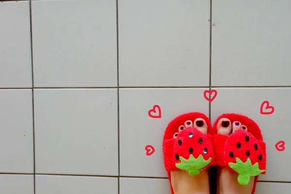 Close Up Woman's Feet Wearing Sandals Strawberry with Violet Nail on Tile Background