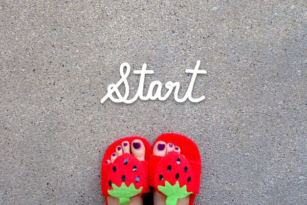 START Word Written Woman 's Feet Wear Sandals Strawberry with Violet Nail on Background — стоковое фото