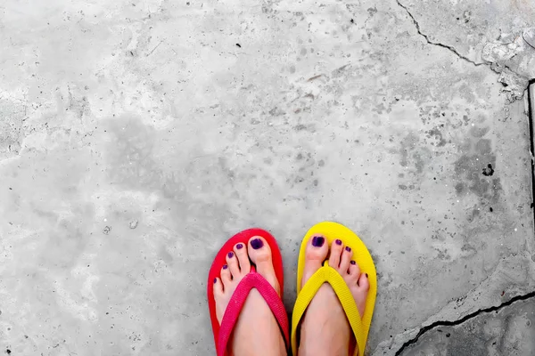 Red and Yellow Flip Flops. Selfie Woman Wearing Flip Flop Standing on Cement