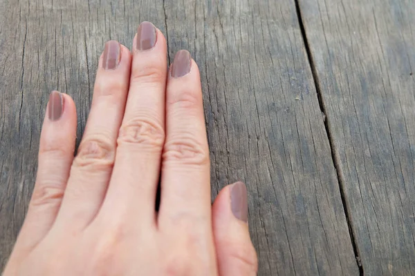 Fashion Brown Manicure Nail Females Hand Nails Polish Wood Background — Stock Photo, Image