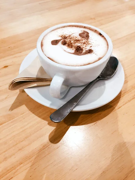 Cocoa Drink in White Cup Isolated. Cup with Hot Chocolate on Wood Table Background Great for Any Use.