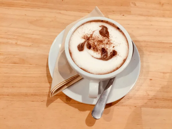 Cocoa Drink in White Cup Isolated. Cup with Hot Chocolate on Wood Table Background Great for Any Use.