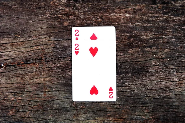 Two of Spades and Diamonds Playing card. Playing cards isolated On Wooden Background Great for Any Use.
