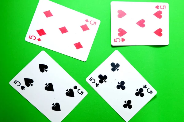 5 Playing Card Game. Old Five of Heart, Spades and Diamonds Playing Cards Isolated On Green Background Great for Any Use.