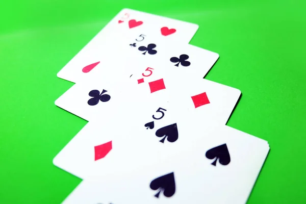 5 Playing Card Game. Old Five of Heart, Spades and Diamonds Playing Cards Isolated On Green Background Great for Any Use.