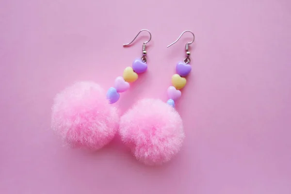 Fur Pink Round Earring Fashion Accessories. Beautiful Pink Pom Heart Earring Isolated on Pink Background Great For Any Use.