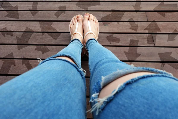 Woman Shoes with Drawn Direction Arrows Choices. Woman Feet and Sandal Standing on Wooden Floor Background Great for Any Use.