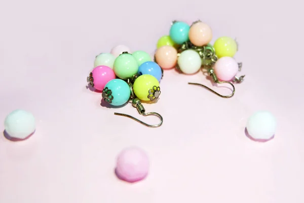 Hoop Earring Fashion Accessories. Colorful Round Earrings Isolated on Pink Pastel with Bead Background Great for Any Use.