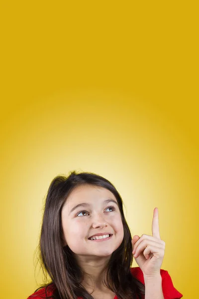 Young girl pointing up — Stock Photo, Image