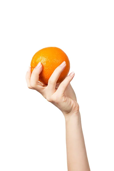 Рука женщины с оранжевым на белом фоне — стоковое фото