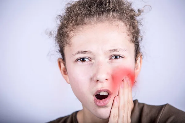 Portrait of a Young girl with toothache over white background — Stock Photo, Image