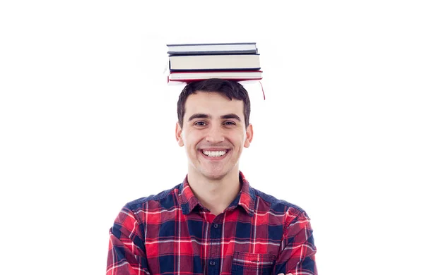 Улыбающийся студент с книгами на голове на белом фоне . — стоковое фото
