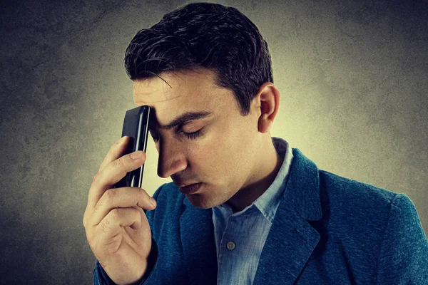 Closeup portrait of depressed, worried young man