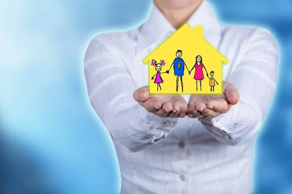 Propriety insurance concept ,Woman holding hands with a drawn family symbol