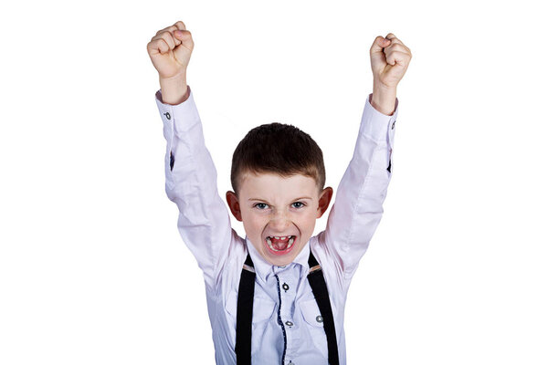 Excited Surprised  little boy holding his fist up